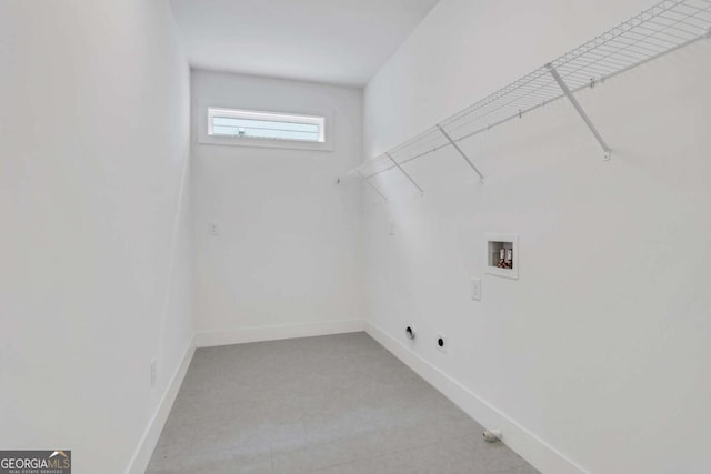 laundry room featuring laundry area, hookup for an electric dryer, baseboards, and washer hookup