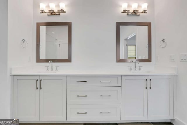 bathroom featuring double vanity and a sink