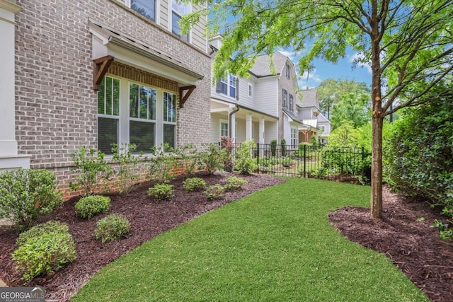 view of yard with a residential view and fence