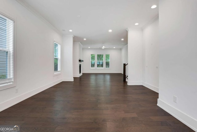 unfurnished living room with recessed lighting, baseboards, dark wood-style floors, and ornamental molding