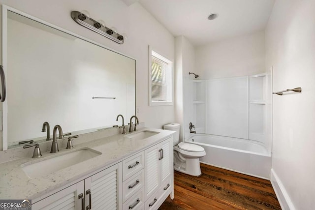 232 Litchfield St, Rockmart, GA 30153 - full bathroom featuring toilet, wood finished floors, double vanity, and washtub / shower combination
