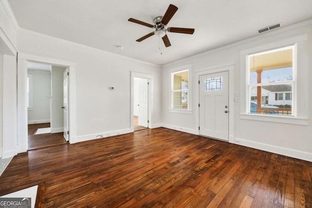 entrance foyer featuring visible vents, a ceiling fan, hardwood / wood-style floors, and ornamental molding