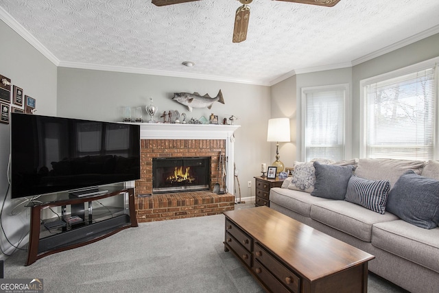 carpeted living area with a fireplace, a textured ceiling, a ceiling fan, and ornamental molding