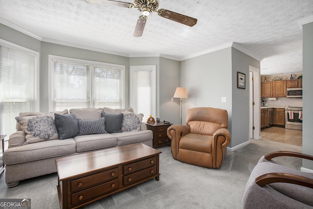 living area featuring crown molding, baseboards, ceiling fan, light colored carpet, and a textured ceiling