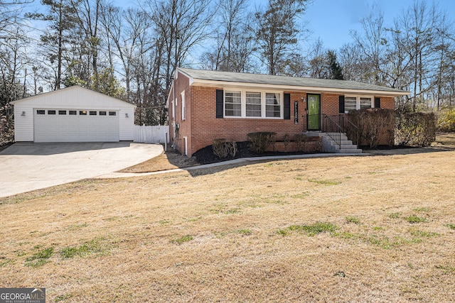 single story home featuring an outbuilding, a front yard, fence, a garage, and brick siding