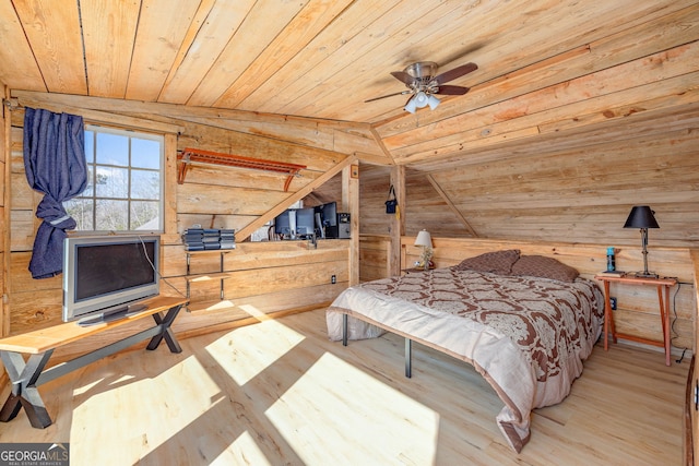 bedroom featuring lofted ceiling, wooden walls, wood ceiling, and wood finished floors