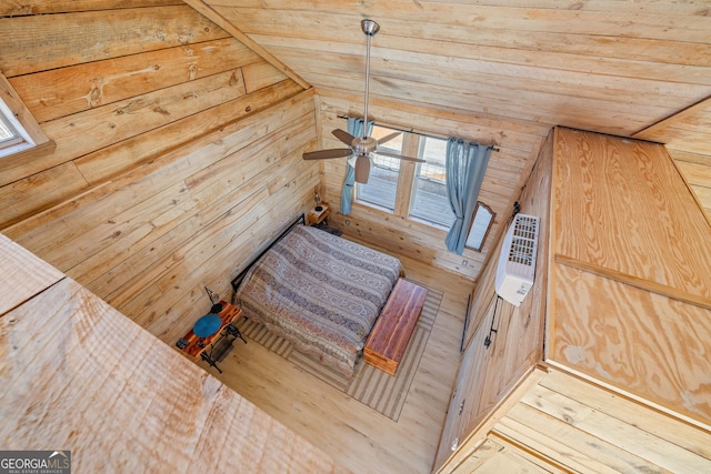 unfurnished bedroom featuring heating unit and wood finished floors