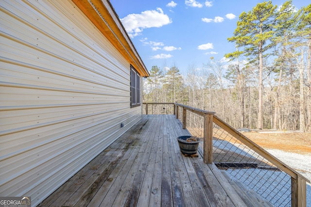 deck featuring a wooded view