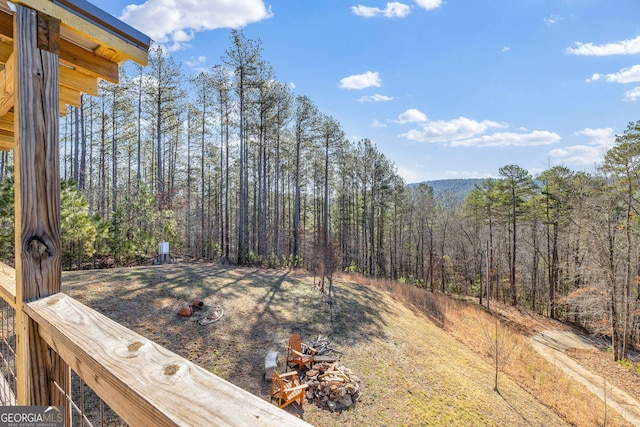 view of yard with a wooded view