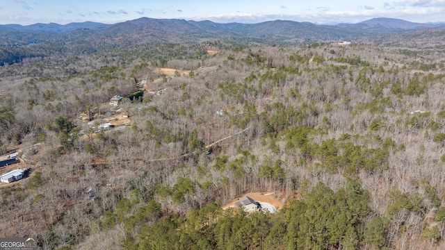 aerial view with a view of trees and a mountain view