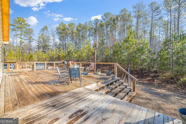 wooden deck with outdoor dining area