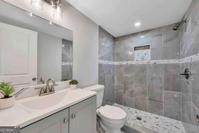 192 Hoke St, Maysville, GA 30558 - bathroom with toilet, recessed lighting, tiled shower, and vanity