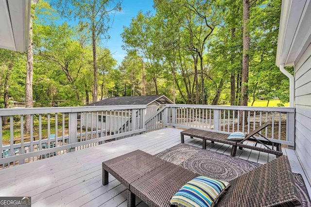192 Hoke St, Maysville, GA 30558 - wooden deck featuring an outbuilding