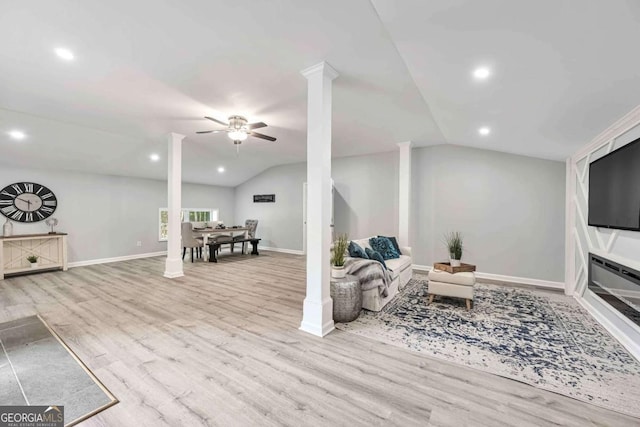 192 Hoke St, Maysville, GA 30558 - living area featuring a ceiling fan, wood finished floors, and vaulted ceiling