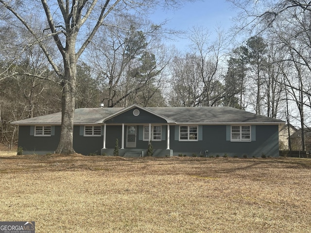 single story home featuring a front yard