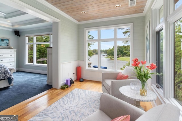 sunroom featuring visible vents and wooden ceiling