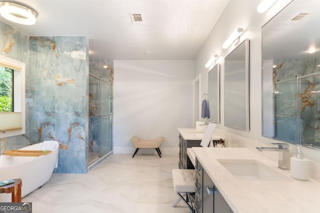 bathroom with visible vents, marble finish floor, a stall shower, and vanity