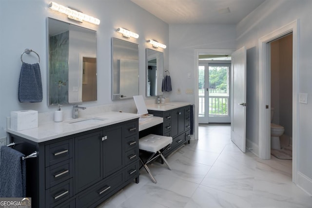 full bath featuring baseboards, toilet, marble finish floor, and vanity