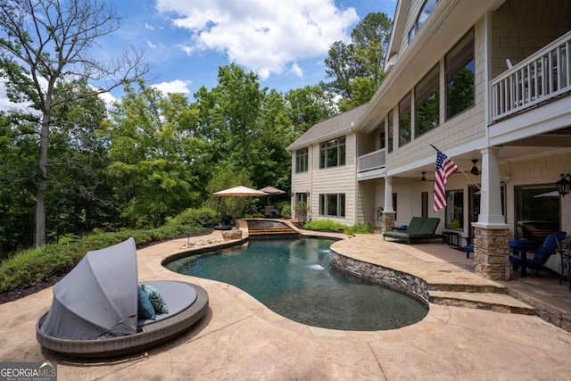 pool featuring a patio area and a ceiling fan