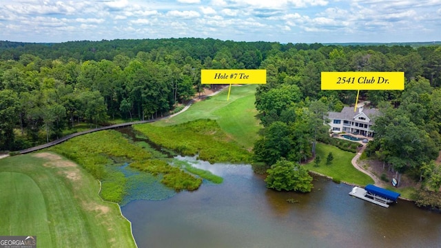 bird's eye view with a view of trees and a water view