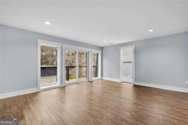 interior space with recessed lighting, baseboards, and wood finished floors