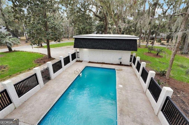 view of pool featuring a fenced in pool, an outbuilding, and fence