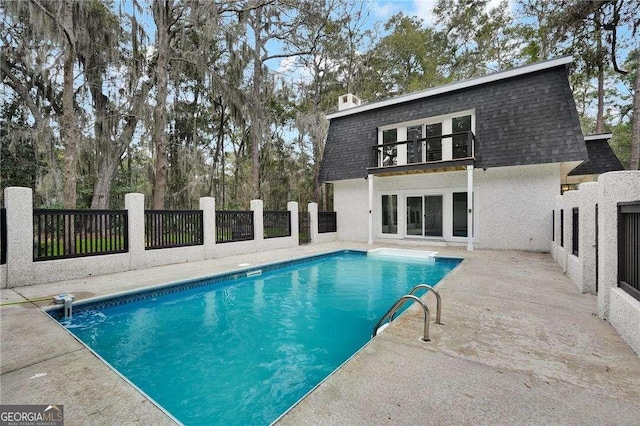 view of pool featuring a fenced in pool, a patio, and fence