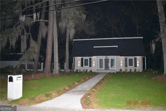 view of front of home with a front lawn