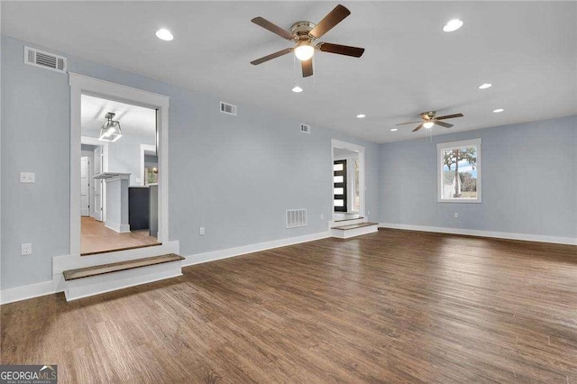 unfurnished living room with visible vents, recessed lighting, baseboards, and wood finished floors