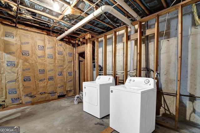 unfinished basement featuring washer and clothes dryer