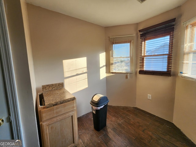 6160 Great Oaks Dr, Lithonia, GA 30058 - empty room featuring dark wood finished floors, visible vents, and a healthy amount of sunlight