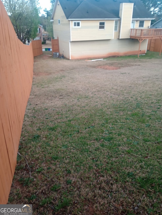 6160 Great Oaks Dr, Lithonia, GA 30058 - view of yard with fence and central AC
