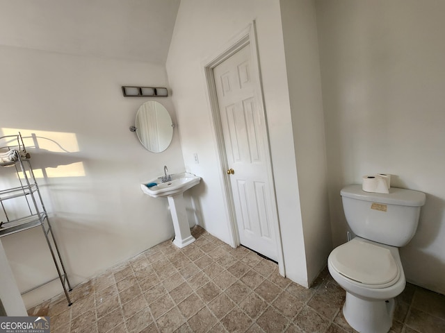 half bathroom featuring toilet