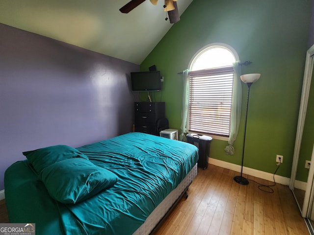 6160 Great Oaks Dr, Lithonia, GA 30058 - bedroom featuring vaulted ceiling, ceiling fan, baseboards, and wood finished floors