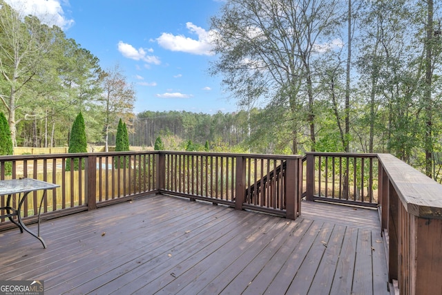 wooden terrace with a forest view