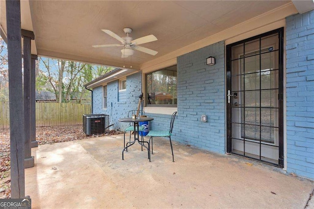 view of patio featuring central air condition unit, ceiling fan, and fence