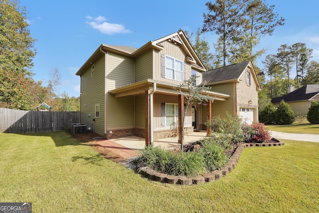 exterior space with a patio area, a front yard, a garage, and fence