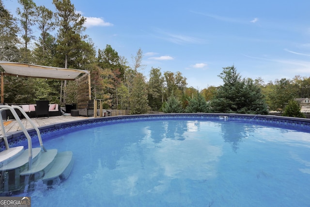 outdoor pool featuring an outdoor living space