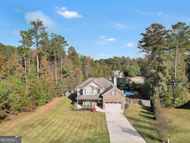 drone / aerial view featuring a view of trees