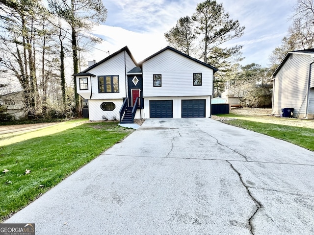 view of front of property featuring a garage, driveway, a chimney, and a front lawn