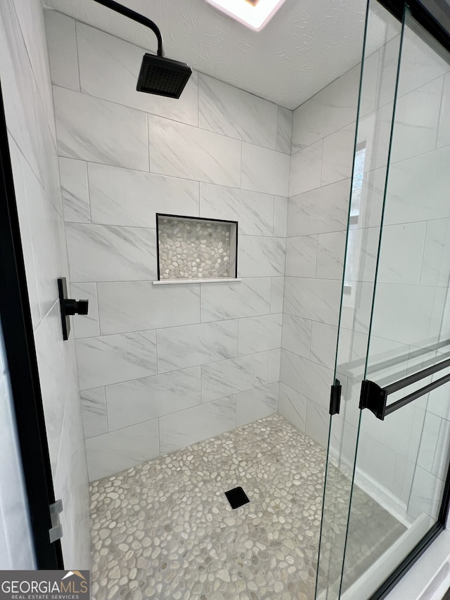 bathroom with a stall shower