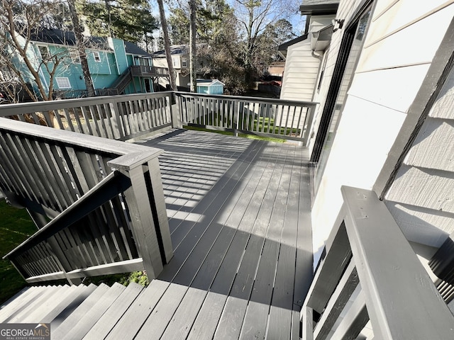 wooden terrace with a residential view