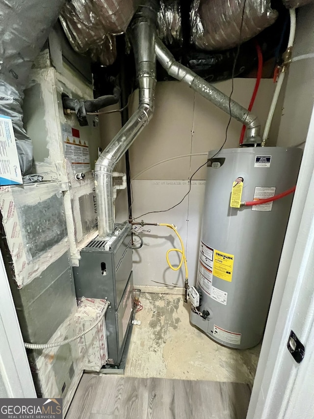 utility room featuring water heater