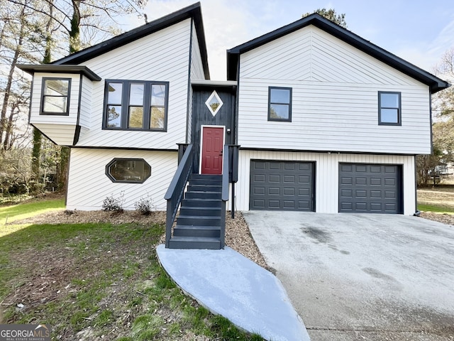 view of front of property featuring an attached garage and driveway