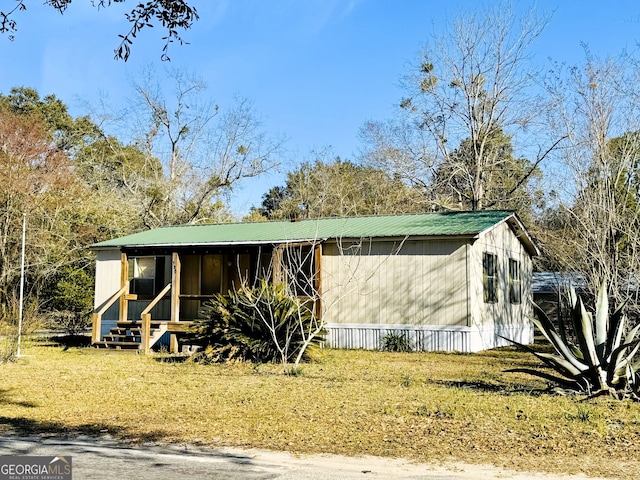 view of front of house featuring metal roof