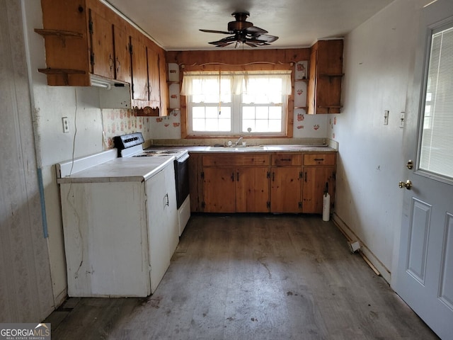 kitchen featuring open shelves, electric range, brown cabinetry, and light countertops