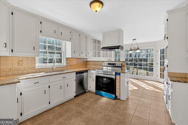 kitchen featuring under cabinet range hood, white cabinets, appliances with stainless steel finishes, and a sink