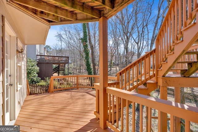 wooden terrace featuring stairs