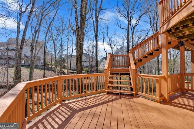 wooden deck featuring stairs