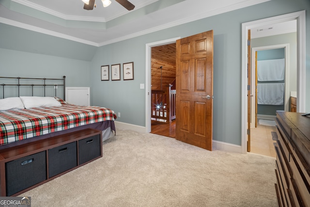 bedroom featuring light carpet, baseboards, and ornamental molding